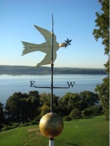 A dove with an olive branch sits atop Mt. Vernon, home of George Washington